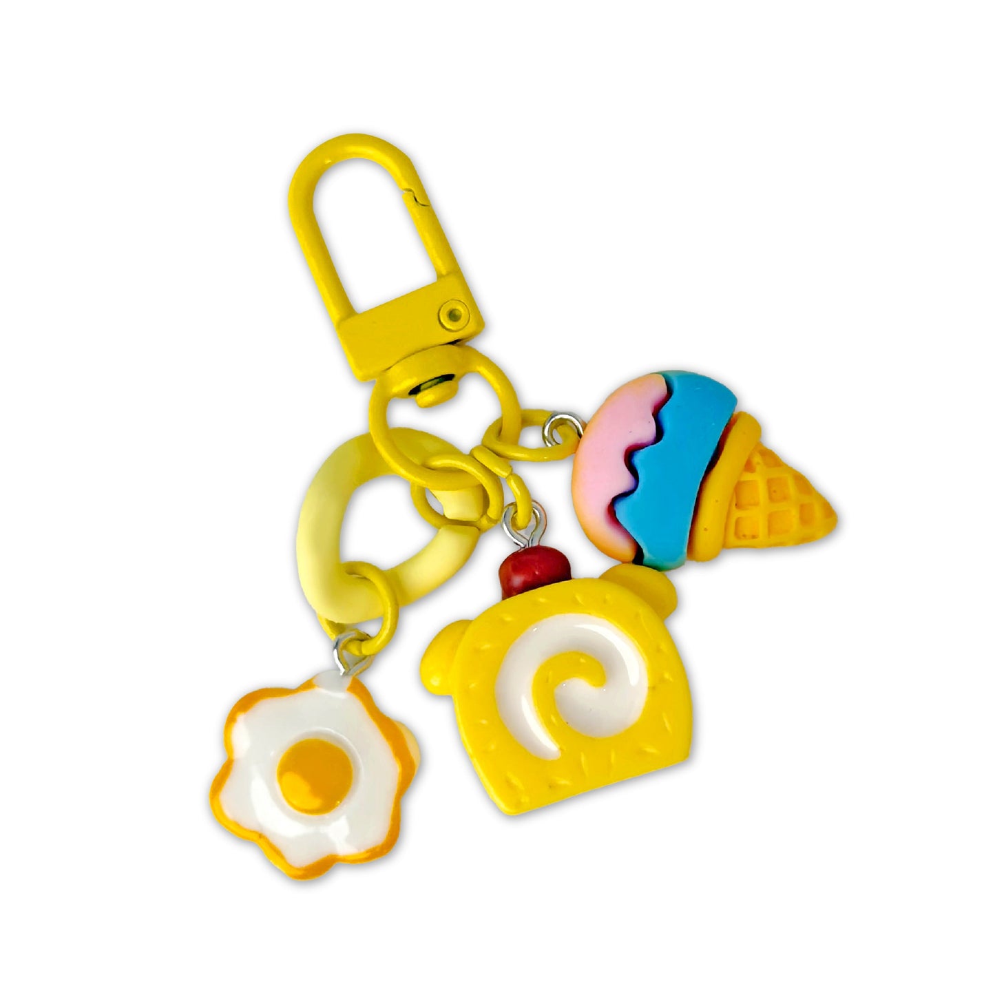 Colorful keychain with ice cream, cake, and egg designs on a white background