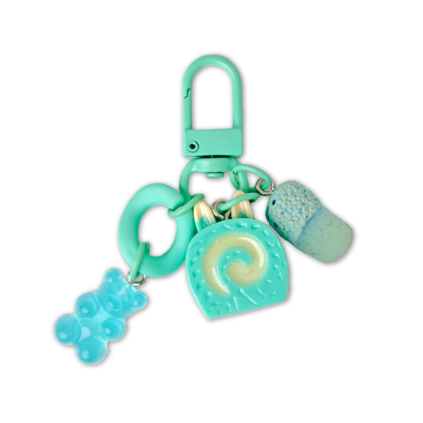 Turquoise keychain with various charms on a white background