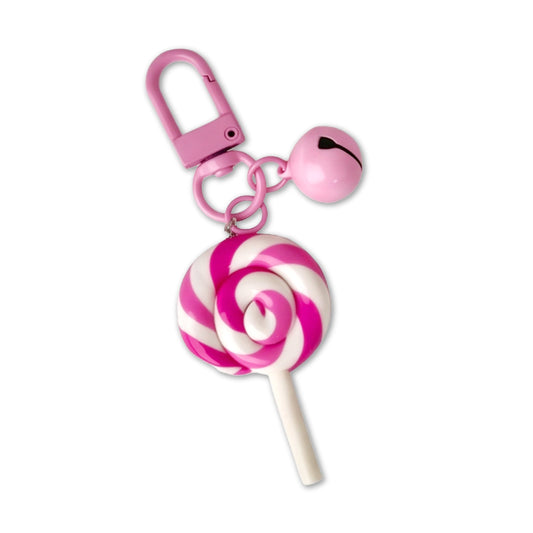 Pink and white lollipop-shaped keychain with a bell on a white background
